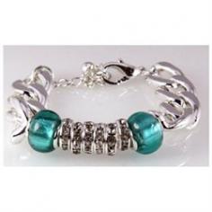 This is a gorgeous fashion bracelet that features a highly polished rhodium plated chain, along with 2 beautiful turquoise beads and a bank of 6 CZ Stone filled beads. The combination is truly beautiful! Has a stretch feature and a lobster claw clasp. Measures 7 inches and has a 2 extender so with the stretch feature, can fit almost any wrist. Comes in a beautiful satin lined gift box with a satin ribbon and bow, no wrapping required.