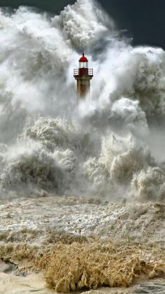 Massive wave! Love the lighthouse peeking out from the water....