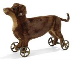 A STEIFF VELVET DACHSHUND ON WHEELS, circa 1904.