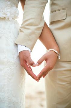 hands and heart photo idea - must have wedding day pose. I love when the groom has tan because it's pure like the bride's dress. It makes them stand out, instead of black