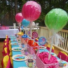Paper lanterns on stick to look like lollipops! Awesomeness! # Could use at Christmas for a gingerbread party