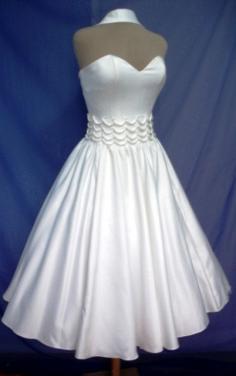 A 50s wedding or cocktail dress in white duchess satin, can be made custom and any size welcome.