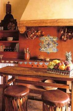 mexican style kitchen with earthy reds, terracotta floor, other decorative tile. So cozy to work in and just hang out in, too.
