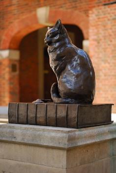 Hodge, Dr Samuel Johnson's cat, seated on his master's dictionary, looking at the home they shared near Fleet Street. According to Boswell, "I never shall forget the indulgence with which he treated Hodge... when I observed he was a fine cat, [Johnson said,] 'Why yes, Sir, but I have had cats whom I liked better than this;' and then as if perceiving Hodge to be out of countenance, adding, 'but he is a very fine cat, a very fine cat indeed.'"