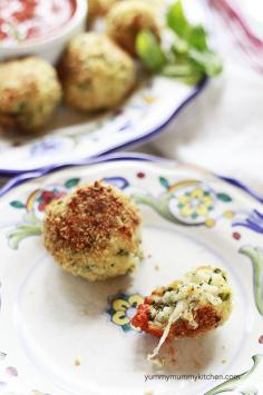 Baked Spinach Arancini Balls We love these crisp on the outside, warm and gooey on the inside snacks!