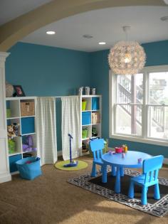 Playroom with curtained "stage" and microphone. This was my dream playroom as a child!