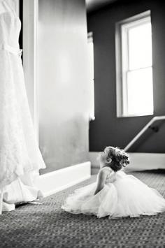 Flower girl looking at wedding dress... Cutest thing I've ever seen