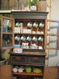 it's only a store display here, but i'd love to have something like this, beautiful fun pottery and all, in my home one day