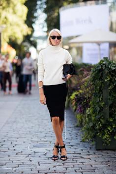 Classic. Simple colors and involves the black long pencil skirt by Dior. And regular white sweater