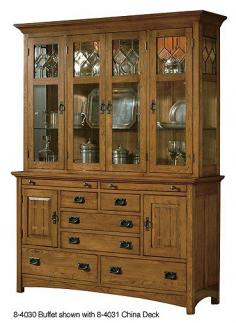 This buffet, which works perfect by itself as a server, or with the Hutch as shown, has got that perfect reproduction feel of the classic Arts & Crafts era. Crafted in. Mission Pointe finish on Oak Solids and Veneers and Graphite finish reproduction hardware. Features two doors with walnut veneer butterfly inlay, silverware drawer liner on top two drawers and two pull-out serving trays on the top of the buffet. Accompanies the 8-4031 Arts & Crafts China Hutch sold separately. Overall Dimensions are 62 in. W x 19 in. D x 38 7/8 in. H Product info furnished by Carolina Rustica