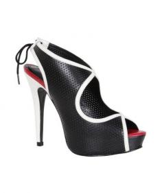 Stand a full five inches taller in Pour La Victoire's Audrey Heel. The peep-toe bootie features an ankle tie and black perforated leather with white trim.