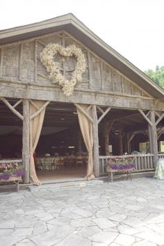 Love the giant floral heart on this barn at this rustic wedding! photo by @Brent & Anna Deitrich - Live View Studios