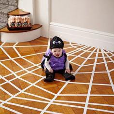 fun idea for halloween or a bug/insect themed birthday party. low-tack white tape on the floor like a spider web