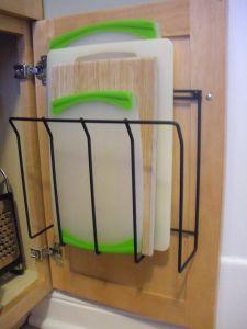 get two of those under-cabinet shelves, use one to store cutting boards!!