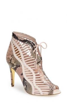 Gorgeous leather bootie sandal styled with stud-adorned laces rstyle.me/...