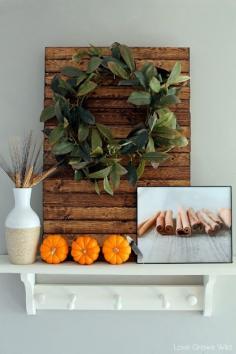 A kitchen beautifully decorated for Fall with sheet music garlands, mini pallet art, and more! So many great ideas here!