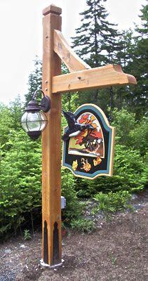 Timber lamp post with sign and light