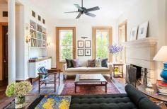 Mixed furniture pieces in a brightly-lit living room.