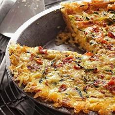 Hash browns can always be counted on to add heartiness to egg breafast recipes. Here, they double as a crisp crust for this irrestible breakfast quiche.