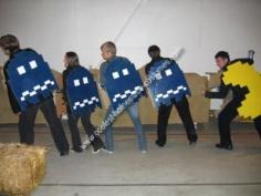Homemade Pac Man Group Costume: My brother and I made this Pac Man Group Costume from cardboard boxes and spray paint. First we drew a grid of pixels on the cardboard and then traced