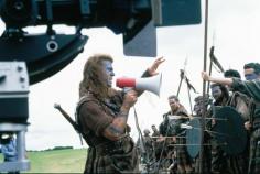 Director Mel Gibson going over some details before a shoot in BRAVEHEART ! The bloody scenes in this film were very REALISTIC !