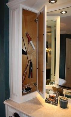 Awesome vanity idea! Cupboard that holds all hairstyling tools, with a plug-in inside. Never have to take them out. LOVE THIS!