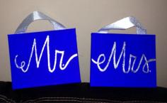 Its on two canvas and the ribbon is used to be able to easily hang the signs from the back of the groom and