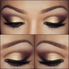 Pretty brown eye makeup with gold eyeshadow .