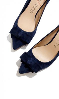 Classic mid heel pumps with a charming bow and pointed toe.
