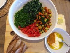 Quick lunch spread. Kale, parsley, tomato and fried sweet potato & zucchini with yoghurt, turmeric, olive oil and salt dressing.