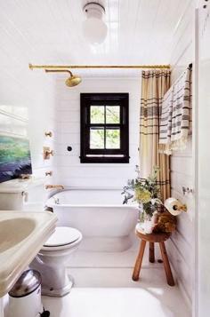 Obsessed with this brass shower head + vintage stool as side table...so chic