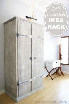 IKEA Hack: Whitewashed Fjell Wardrobe with Pallet Shelves | We took a drab IKEA wardrobe and made it our own. A little paint, shelving, lighting, and more and you have your very own IKEA hack!