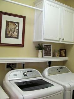 Laundry room ideas - cabinet, shelf, and hanging rod.  I like this b/c it still allows the dryer vent area "air" so it doesn't get too hot (house fires).