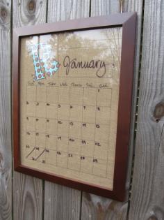 Dry Erase Calendar...Framed Burlap with Family Initial. Put Calendar base and days of week on the burlap. Then write the Month and numerical days with a dry erase pen.