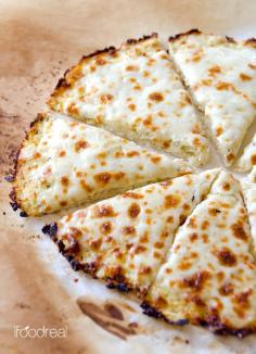 Cauliflower Pizza Crust Recipe -- Low carb, low calorie and gluten free cauliflower crust pizza that can take on any of your favourite toppings. Foolproof and delicious low carb meal recipe.