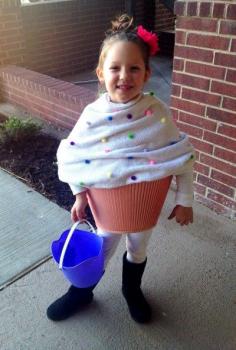 DIY Cupcake halloween costume for kids using a blanket, pom poms, and an upside down lampshade. Genius!