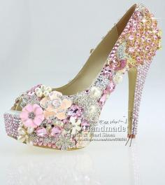 Probably the prissiest shoe I have ever liked but all those flowers.... its a gorgeously unique heel. Wedding day shoe perfection.