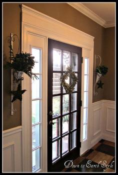 Bulk up trim above door. Black interior door.