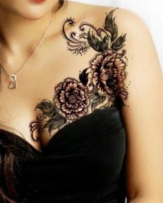 
                        
                            This feminine tattoo of flowers and leaves could be lowered to hide a mastectomy tattoo. P.ink.org
                        
                    