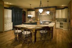 
                        
                            The pendant ceiling lights over the large kitchen island provides enough light to illuminate your large kitchen. The mixture of high end finishes and the dark wood flooring also gives your kitchen the modern touch it needs. #kitchendesign #ideas
                        
                    