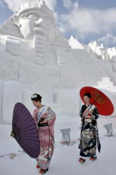 
                        
                            In front of ice carving of Egyptian temple....Japan?
                        
                    