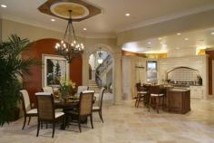 An open kitchen is a dream to us all. The elegant space with a classic chandelier, stainless steel range and a round dinning room table. This is a family-friendly kitchen. #hugespace