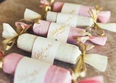 Bridal Shower Favor: Use tissue paper to neatly wrap a classic red lipstick that works on everyone. Then tie off the ends with gold ribbon so the tubes look like cute pieces of candy.