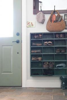 OH GOODNESS...I love love love this shoe storage or whatever storage. It is off the ground & easier to reach & clean under (also leaves space for super tall rain or work boots if needed)...awesome idea!