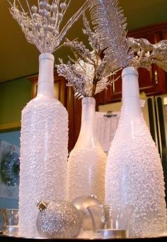 
                        
                            SPRAY YOUR EMPTY WINE BOTTLES WITH GLUE AND FAKE SNOW, ADD A FEW BAUBLES AND LIT TWIGS
                        
                    