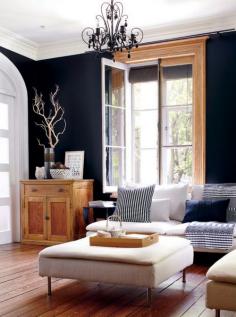 black walls with warm wood moldings