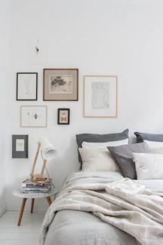asymetrical art placement in the bedroom