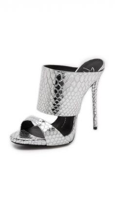 Crackled, metallic snake-embossed leather lends striking glamour to these double-strap Giuseppe Zanotti mules. Peep toe. Covered platform and stiletto heel. Leather sole.
