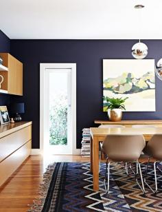 
                        
                            gorgeous dining room with indigo walls and wood tones
                        
                    