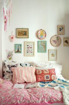 lovely pinks and white and photos on the wall